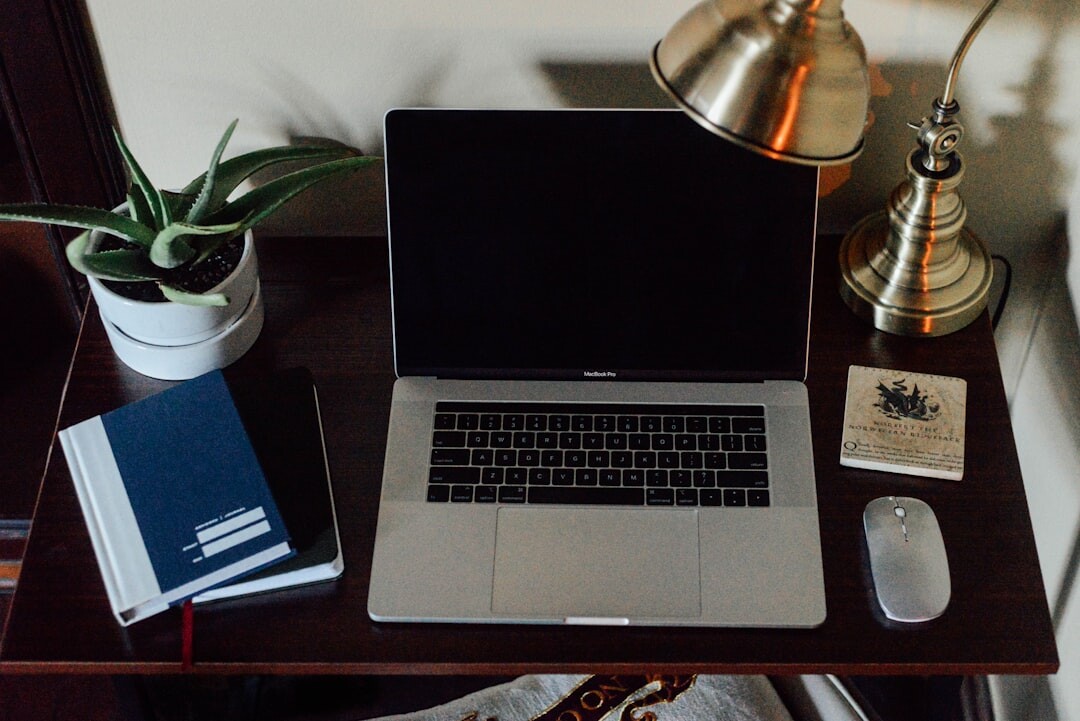 Desk with laptop, notebook and planning documents